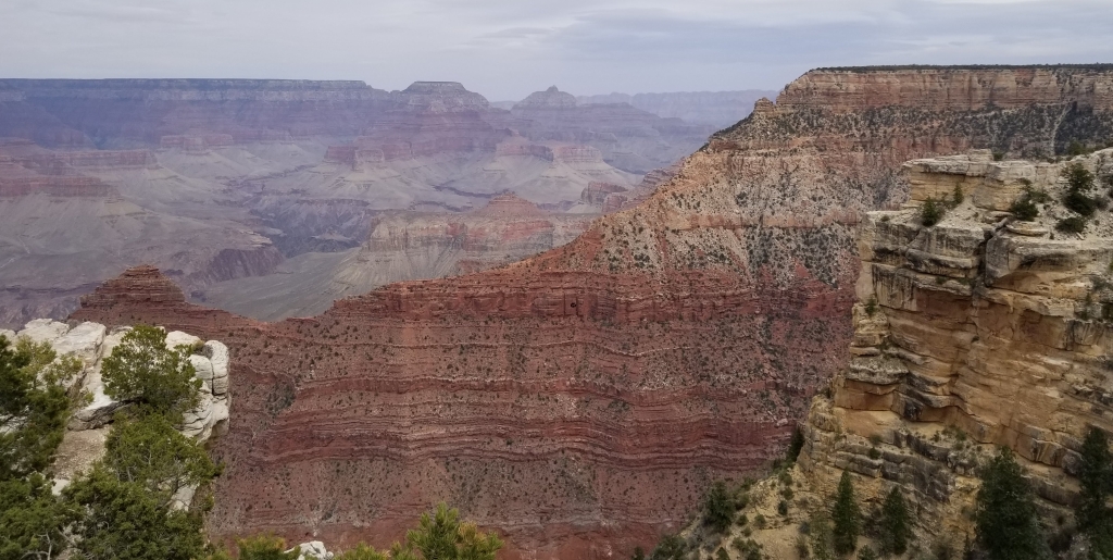 A view of the Grand Canyon where you can see how far it extends and the stratigraphy along its walls.