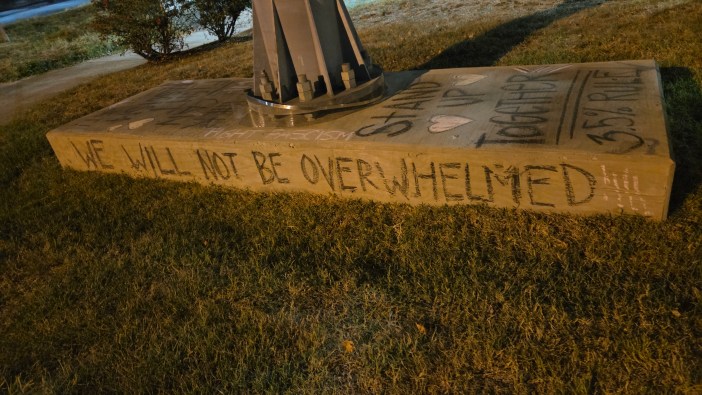 Words on a cement block calling for resistance
