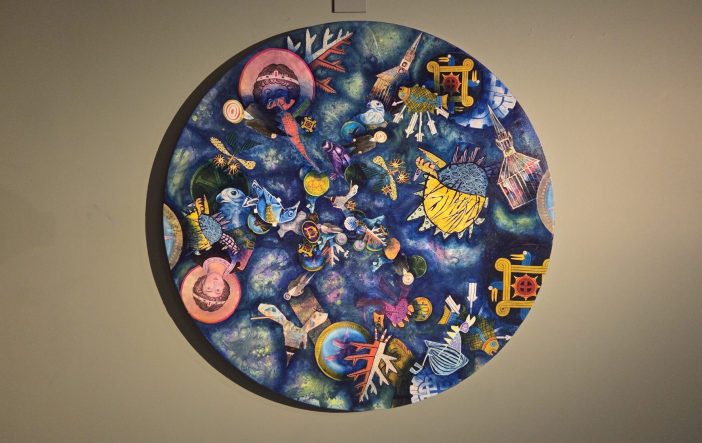 A circular painting with a blue background filled with symbolic and other imagery.